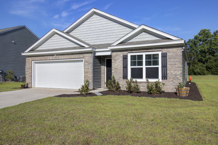 Front exterior of a new home in Stone Ridge, Moncks Corner, SC, highlighting curb appeal (Image 2). Front exterior of a new home in Stone Ridge, Moncks Corner, SC, highlighting curb appeal (Image 2).