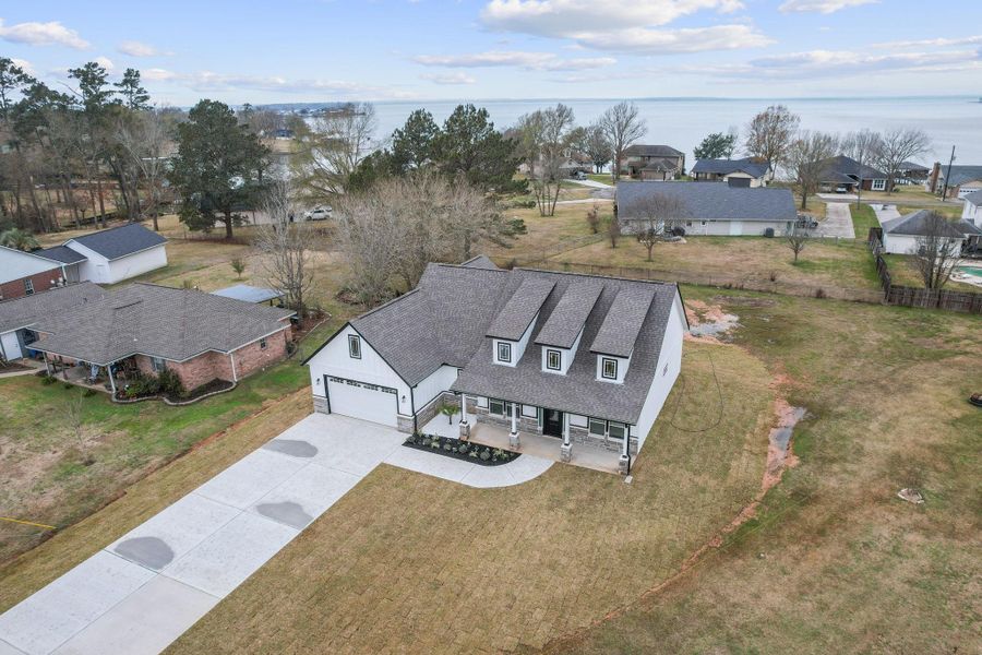 You'll enjoy water views from the spacious back porch. You'll enjoy water views from the spacious back porch.