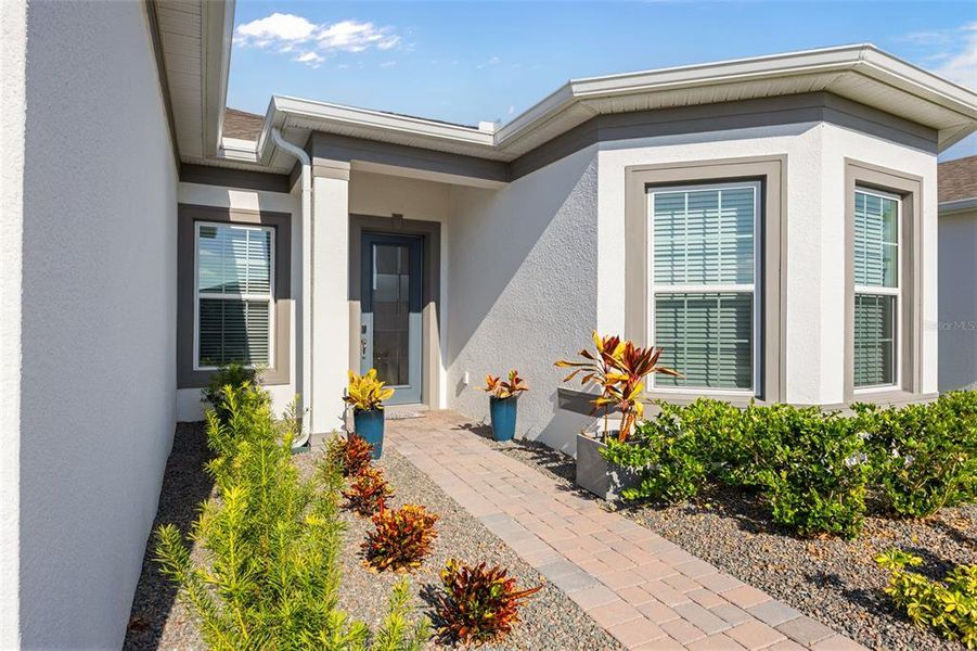 Exterior details and patio area of a home in Del Webb Sunbridge, St. Cloud (Image 4).
