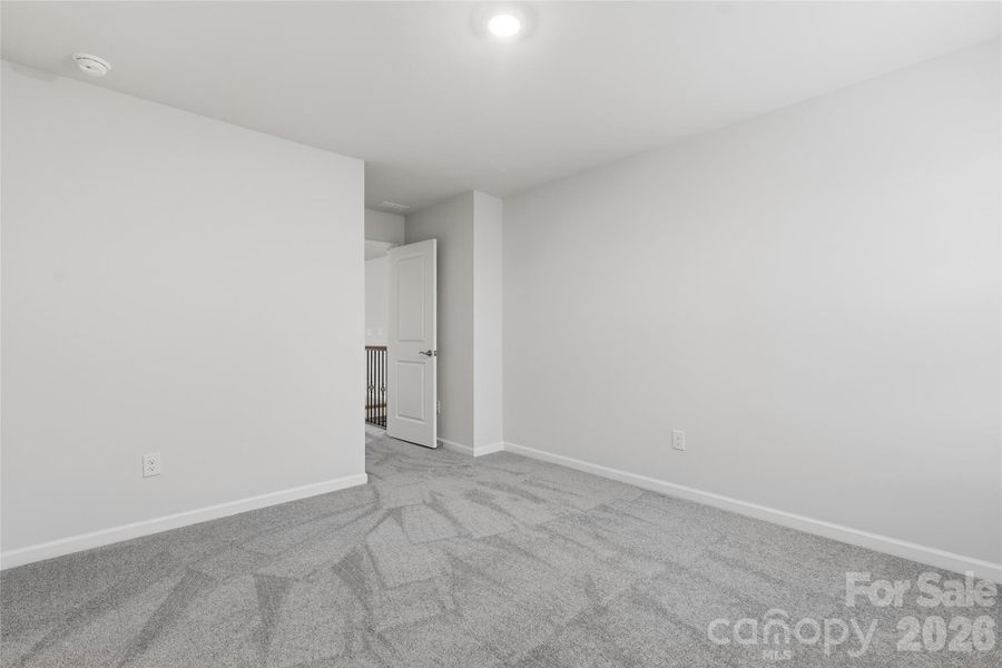 Spacious, unfurnished interior of a new home in Redhawk: Enclave, Belmont (Image 15).