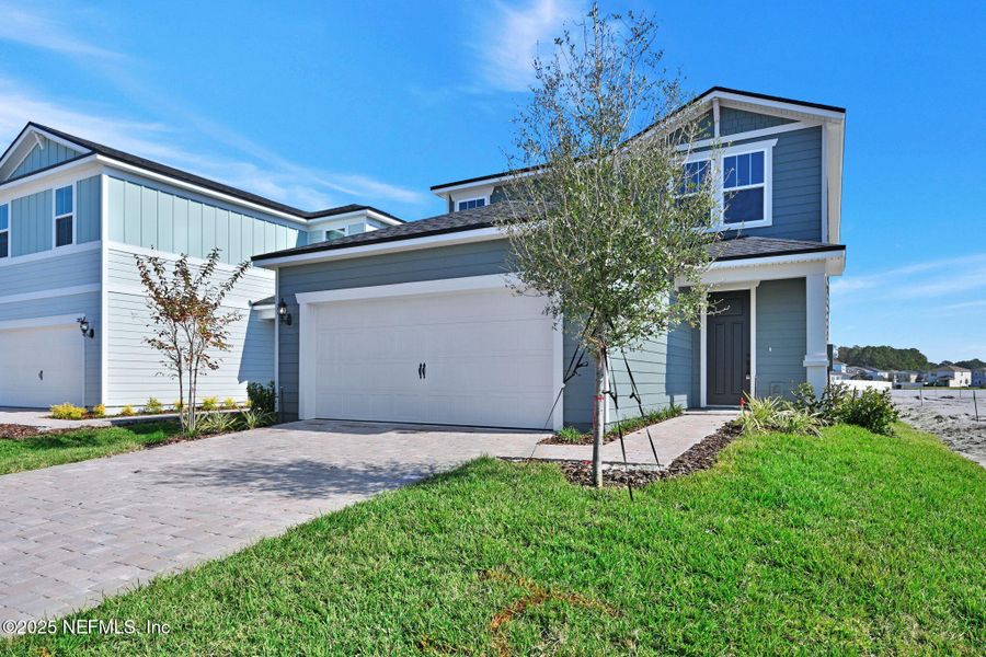 Front exterior of a new home in The Preserve at Bannon Lakes, St. Augustine, FL, highlighting curb appeal (Image 2). Front exterior of a new home in The Preserve at Bannon Lakes, St. Augustine, FL, highlighting curb appeal (Image 2).