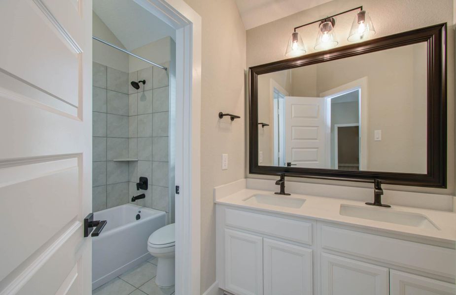 Furnished interior view inside a new home in Harper's Preserve - Classic Series, Conroe (Image 15). Furnished interior view inside a new home in Harper's Preserve - Classic Series, Conroe (Image 15).