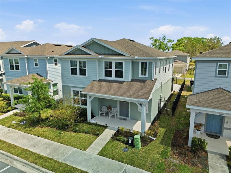 Front exterior of a new home in Winding Meadows, Apopka, FL, highlighting curb appeal (Image 26).