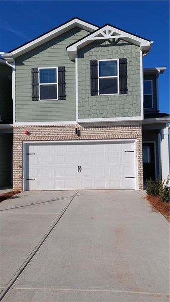 Front exterior of a new home in The Enclave Townhomes, Hampton, GA, highlighting curb appeal (Image 22).