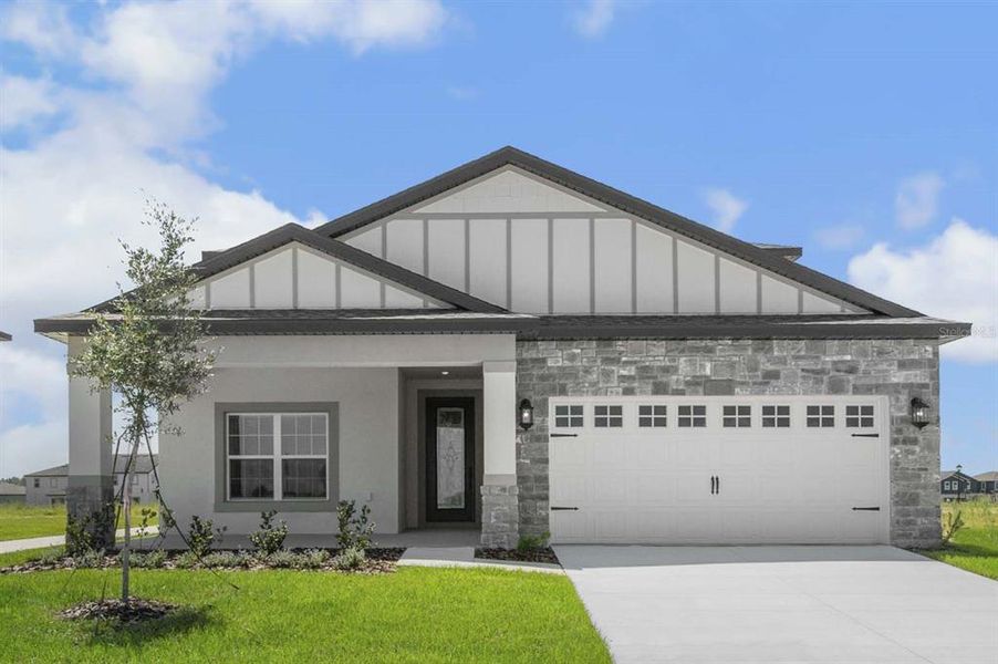 Front exterior of a new home in Gum Lake Preserve, Lake Alfred, FL, highlighting curb appeal (Image 1). Front exterior of a new home in Gum Lake Preserve, Lake Alfred, FL, highlighting curb appeal (Image 1).
