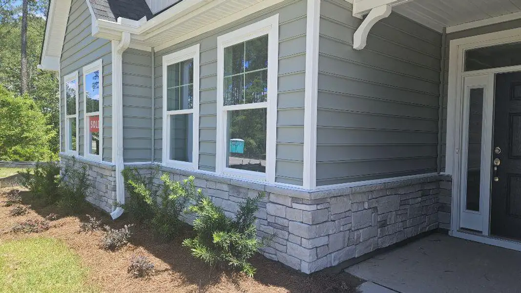 Exterior details and patio area of a home in The Enclave at French Quarter Creek, Huger (Image 3).