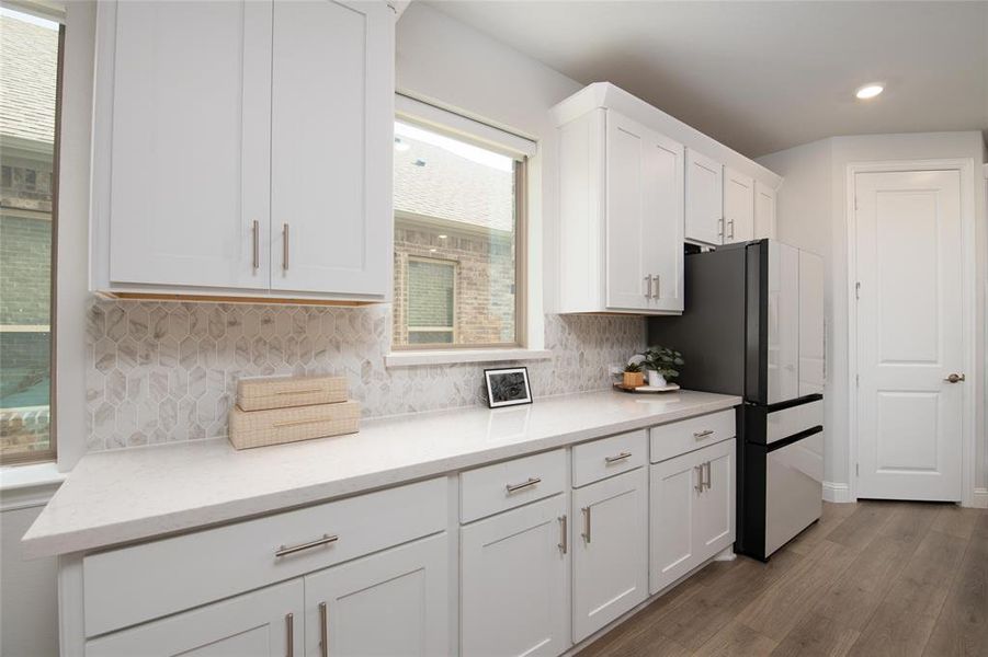A farmhouse sink, generous counter space, and plentiful storage make this kitchen as practical as it is beautiful. A farmhouse sink, generous counter space, and plentiful storage make this kitchen as practical as it is beautiful.