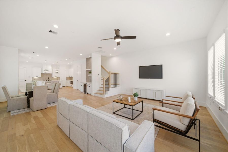 Expansive first-floor layoutconnects the living, dining, andkitchen spaces, perfect forentertaining and everyday living. (Photo of a previous build, similar finishes.)