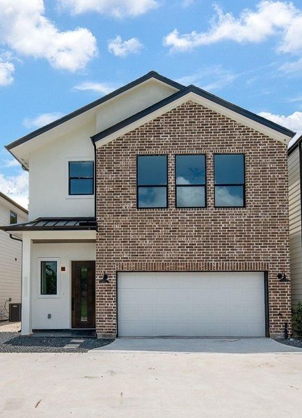 Front exterior of a new home in , Houston, TX, highlighting curb appeal (Image 23).