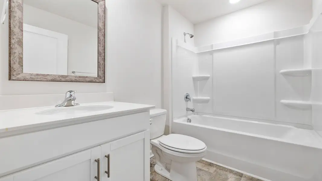 Furnished interior view inside a new home in Bentley Park, Greenwood (Image 4).