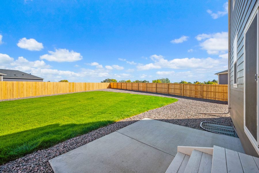 Exterior details and patio area of a home in The Glen-12, Colorado Springs (Image 26).