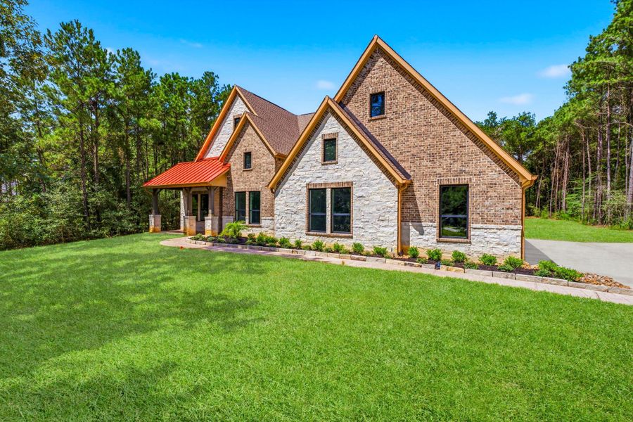 Stylish four-sided brick and stone elevation.