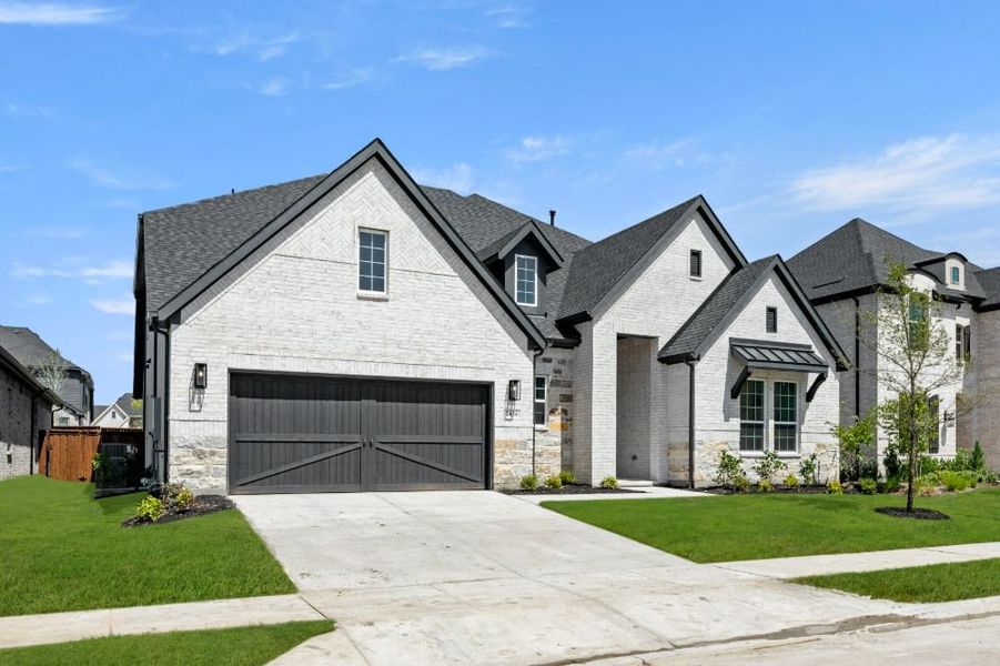 Front exterior of a new home in Cambridge Crossing, Celina, TX, highlighting curb appeal (Image 1). Front exterior of a new home in Cambridge Crossing, Celina, TX, highlighting curb appeal (Image 1).