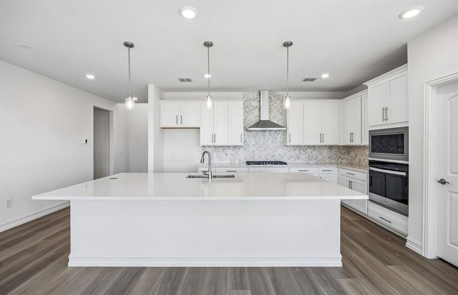 Spacious kitchen with eat-in bartop island Spacious kitchen with eat-in bartop island