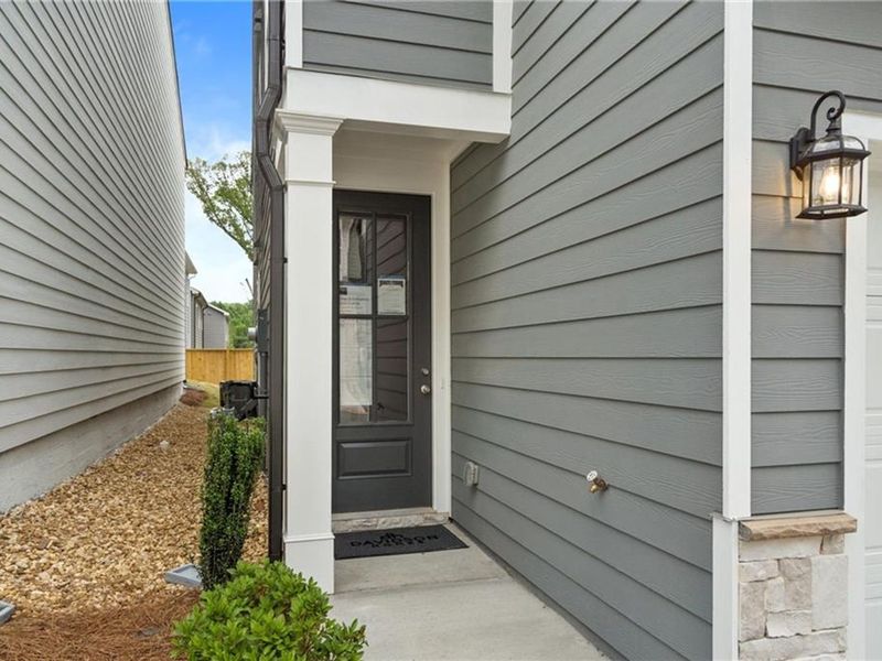 Exterior details and patio area of a home in The Village at Shallowford, Kennesaw (Image 1).