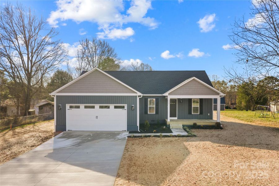 Front exterior of a new home in , Statesville, NC, highlighting curb appeal (Image 18).