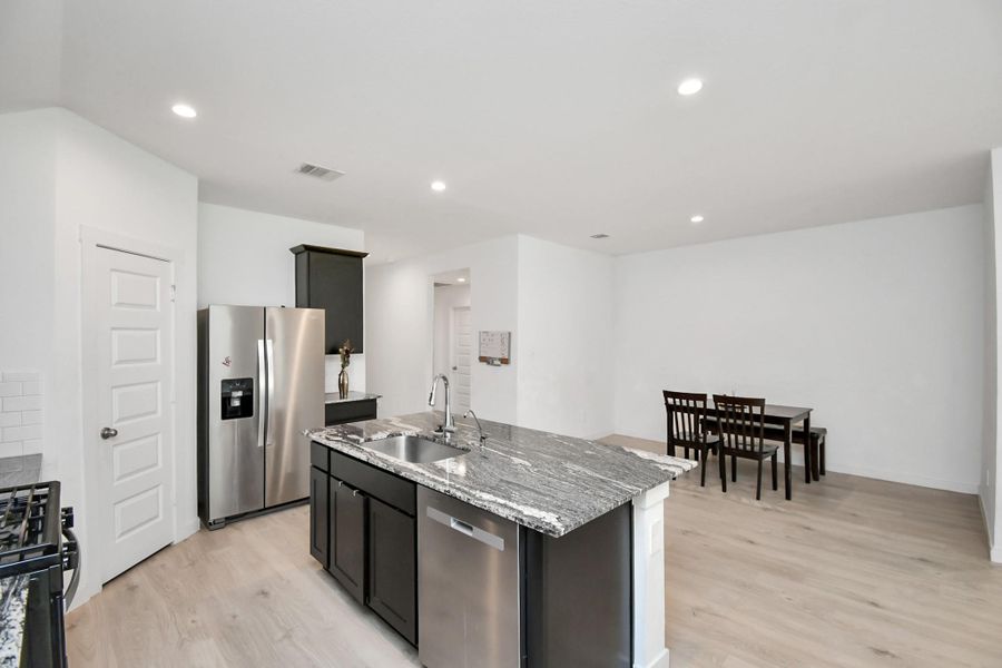 Furnished interior view inside a new home in Post Oak Pointe, Fresno (Image 13).
