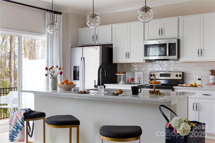 Central Island Ideal for Entertaining or Casual Dining. *Model Photos | Actual Finishes, Structural Selections, and Orientation May Vary.