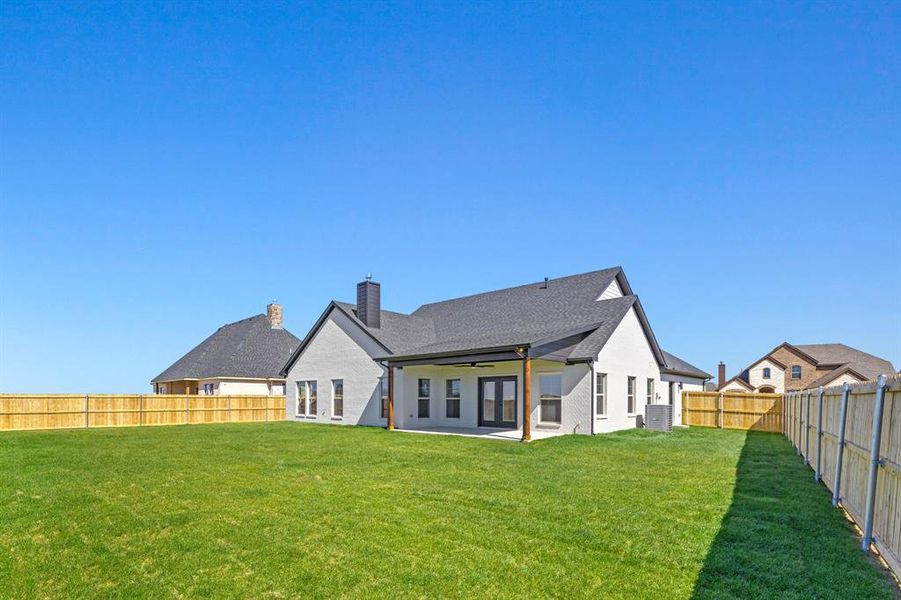 Front exterior of a new home in , Cleburne, TX, highlighting curb appeal (Image 1).