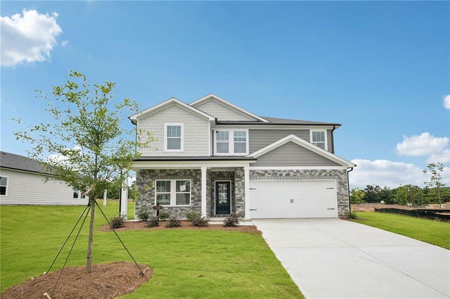 Front exterior of a new home in Northwoods at Mirror Lake, Villa Rica, GA, highlighting curb appeal (Image 2). Front exterior of a new home in Northwoods at Mirror Lake, Villa Rica, GA, highlighting curb appeal (Image 2).