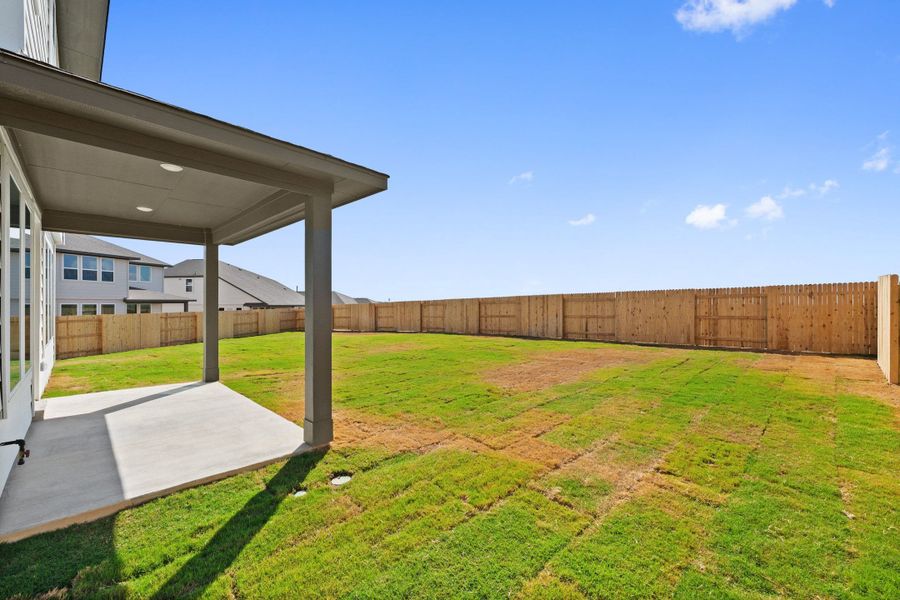 Exterior details and patio area of a home in Terrace Collection At Turner's Crossing, Buda (Image 28).