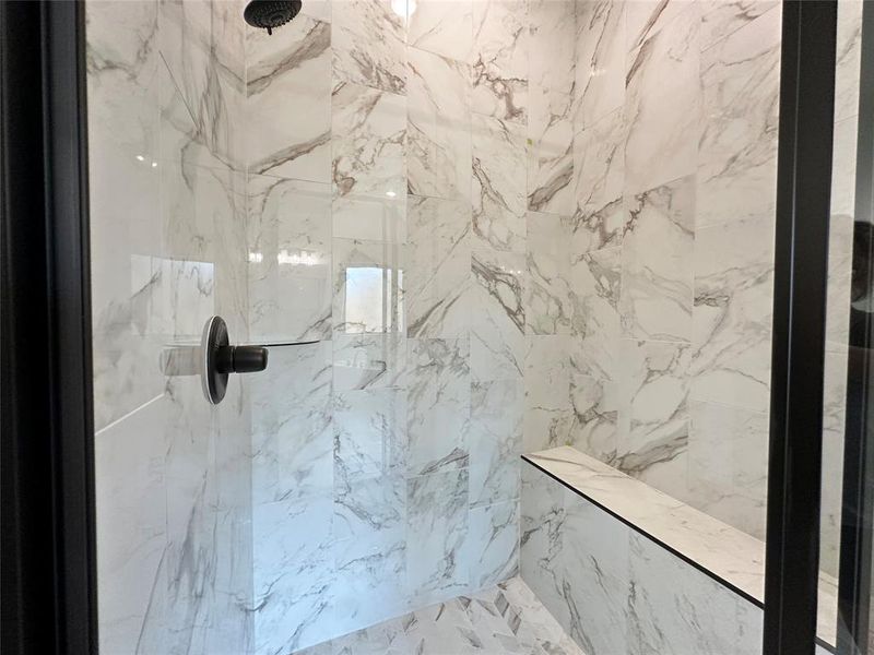 Bathroom view of a marble finish shower