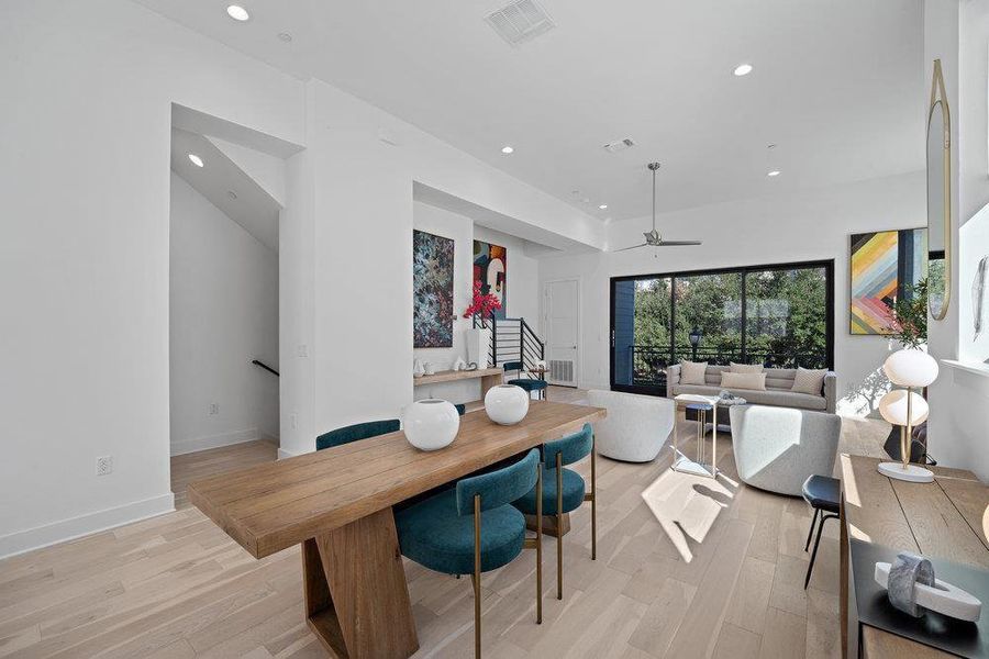 Dining area with light wood-style flooring, a ceiling fan, and recessed lighting Dining area with light wood-style flooring, a ceiling fan, and recessed lighting