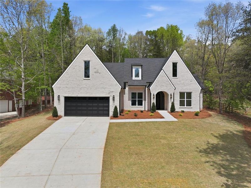 Front exterior of a new home in , Clermont, GA, highlighting curb appeal (Image 1). Front exterior of a new home in , Clermont, GA, highlighting curb appeal (Image 1).