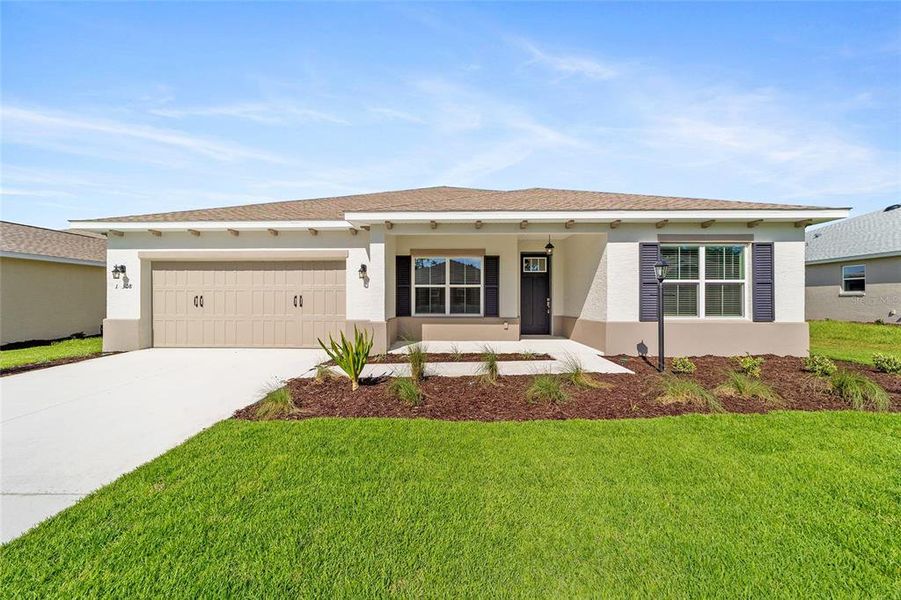 Front exterior of a new home in On Top of the World Communities, Ocala, FL, highlighting curb appeal (Image 15).