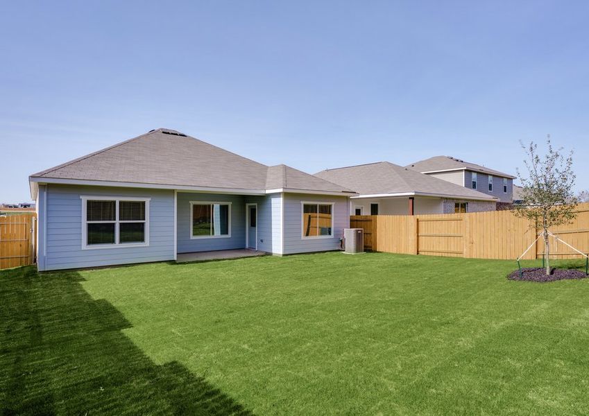 The back yard is fully fenced in.