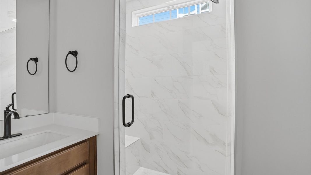 First-rate primary bathroom offering an elegant walk-in shower and dual sinks with superior style in Greenville, SC