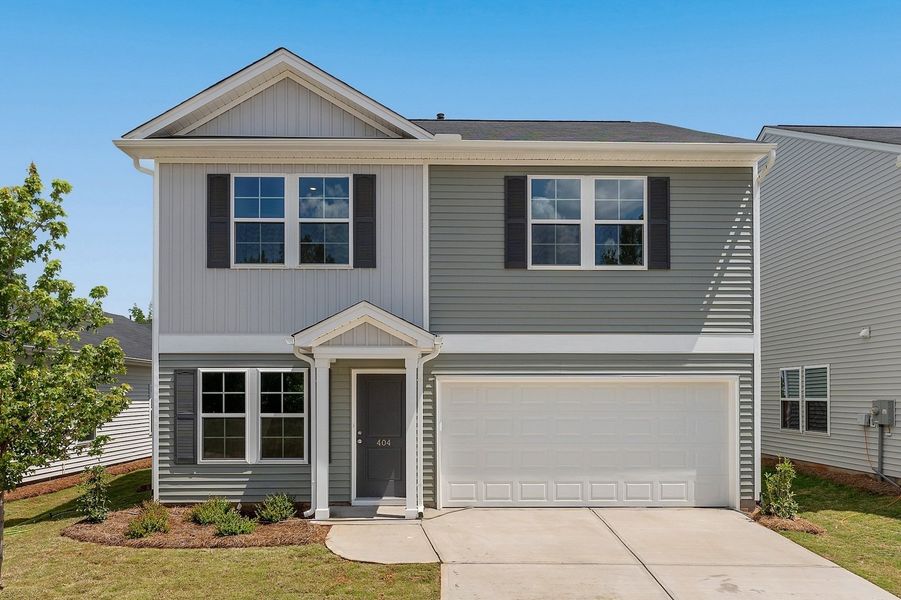 Front exterior of a new home in Braxton Place, Moore, SC, highlighting curb appeal (Image 1). Front exterior of a new home in Braxton Place, Moore, SC, highlighting curb appeal (Image 1).