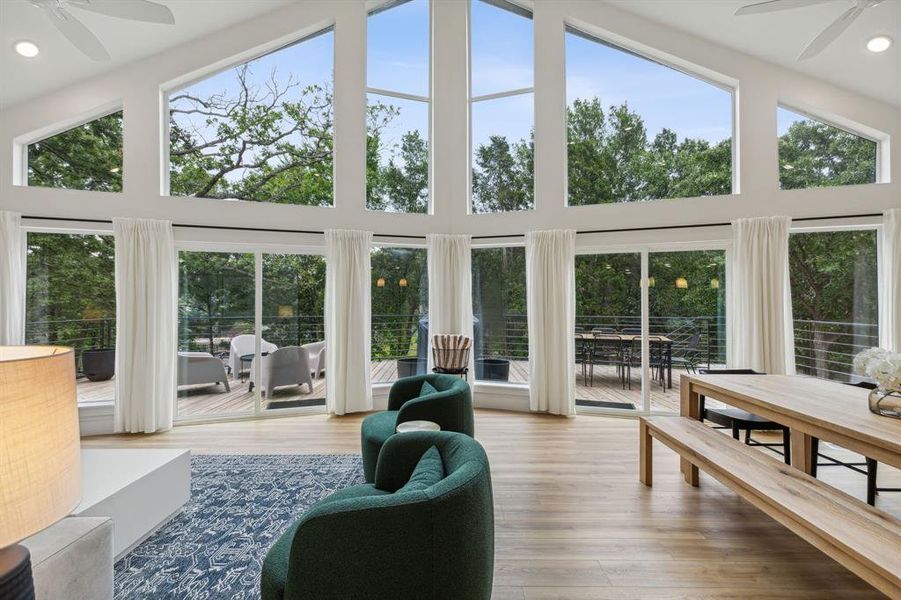 Sunroom / solarium featuring ceiling fan