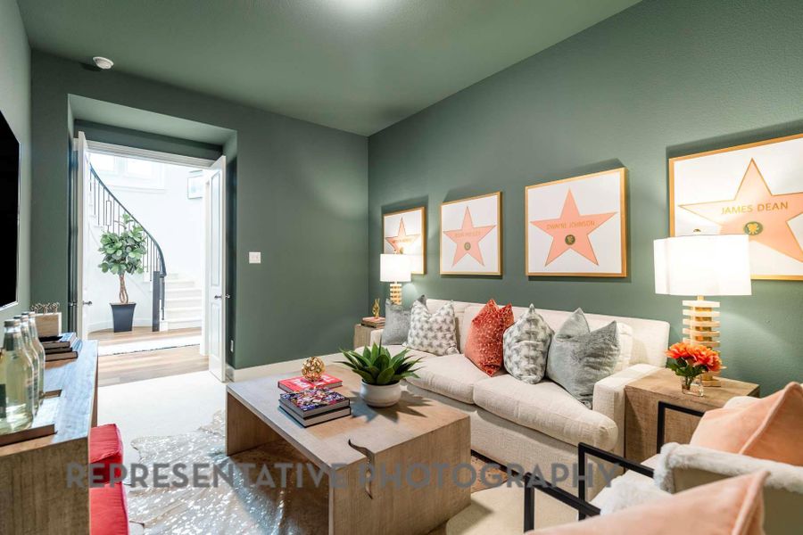 Living room featuring baseboards and wood finished floors Living room featuring baseboards and wood finished floors