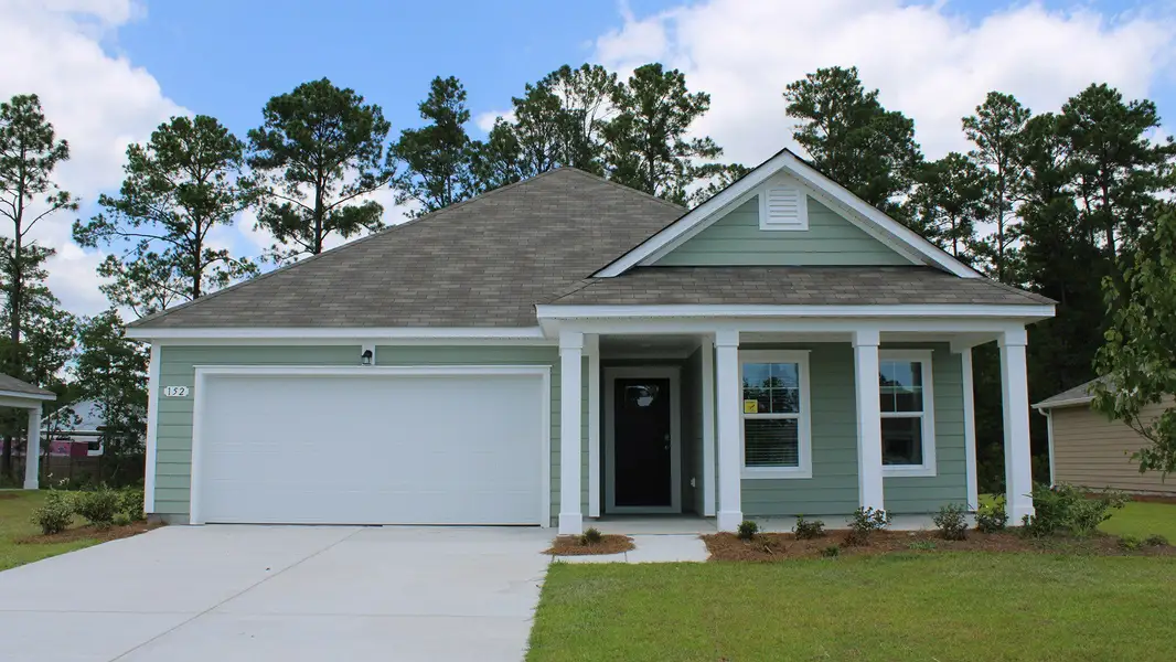Representative exterior photo of a completed home built from the ARIA by D.R. Horton in Rich Square at Brunswick Plantation, Ash, NC (Image 1).