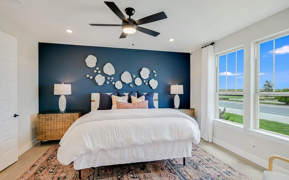 Bedroom featuring an accent wall, recessed lighting, a ceiling fan, and light wood finished floors