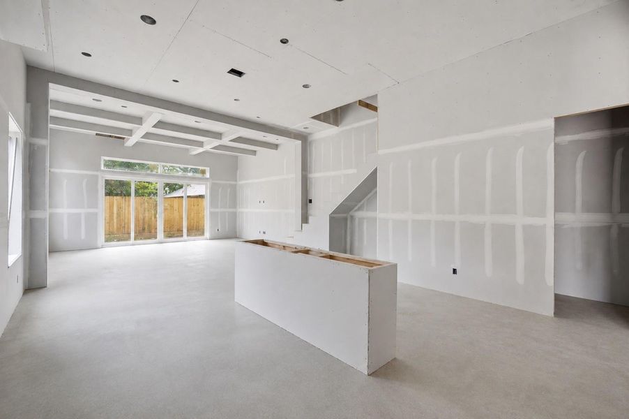 Sliding glass doors extend the living space to the backyard, creating a seamless indoor-outdoor connection. Sliding glass doors extend the living space to the backyard, creating a seamless indoor-outdoor connection.