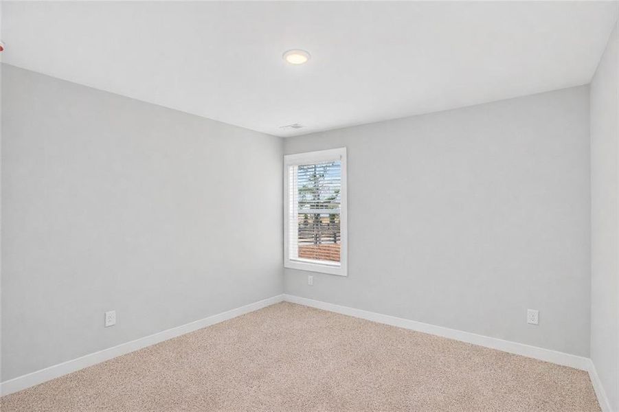 Spacious, unfurnished interior of a new home in The Fairways at Mirror Lake, Villa Rica (Image 31).