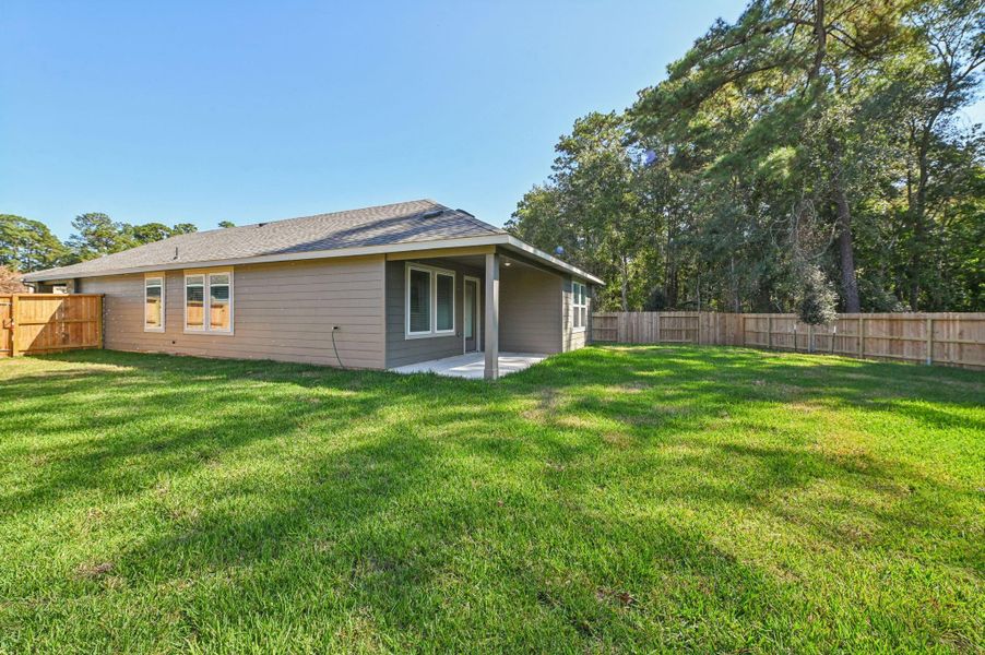 Exterior details and patio area of a home in , Conroe (Image 3).