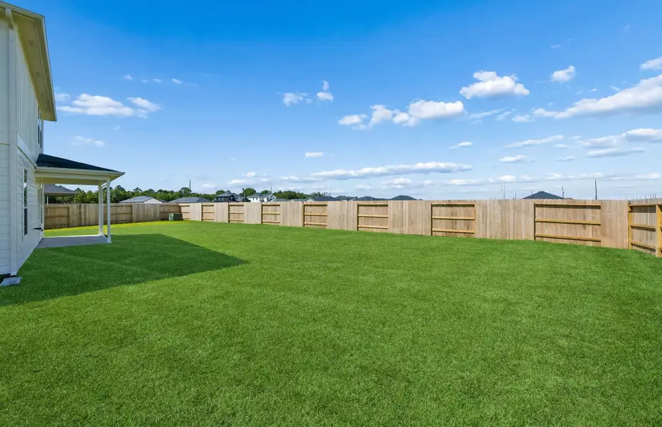 Exterior details and patio area of a home in Windcress, Cove (Image 4).