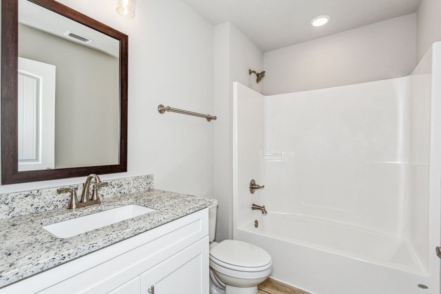Representative furnished interior of a home built from the The Carlos by Herbst Homes in Doyle Hawkins Landing, Navarre (Image 69).