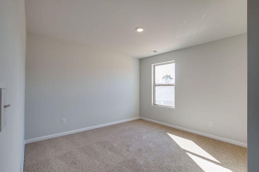 Representative unfurnished interior of a home built from the HAYDEN by D.R. Horton in The Parks, White House (Image 22).