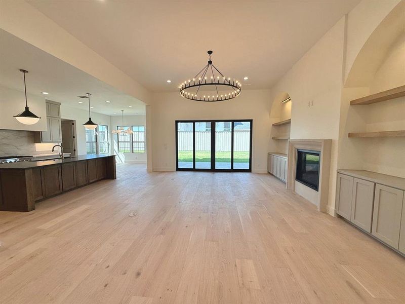 Downstairs living area. Large sliding rear to door to the back porch. Open Concept floor plan.