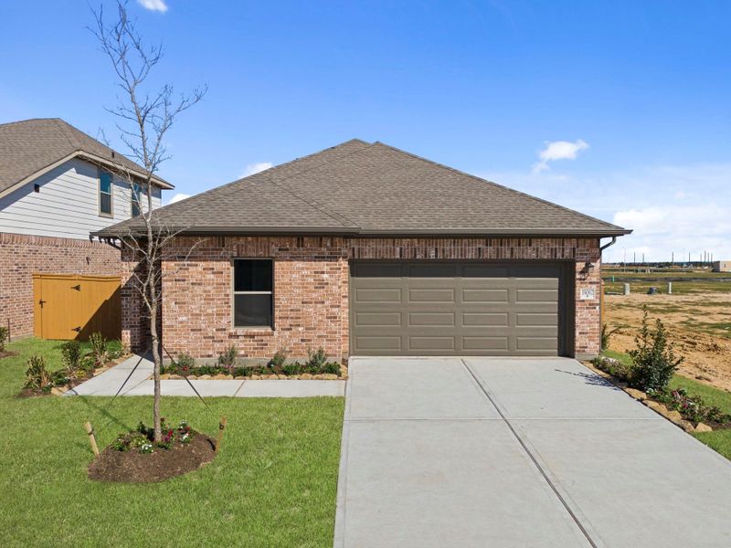 Front exterior of a new home in Cypress Green, Hockley, TX, highlighting curb appeal (Image 20).
