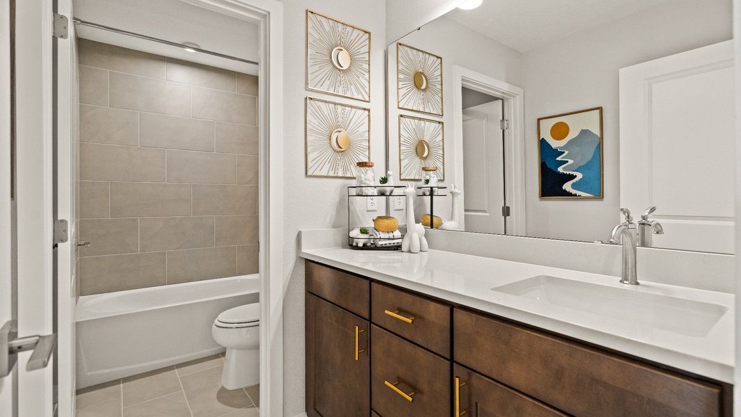 Secondary Bathroom in the Model Highbourne by DRB Homes in Hamilton Bluff located in Haines City, FL. Secondary Bathroom in the Model Highbourne by DRB Homes in Hamilton Bluff located in Haines City, FL.