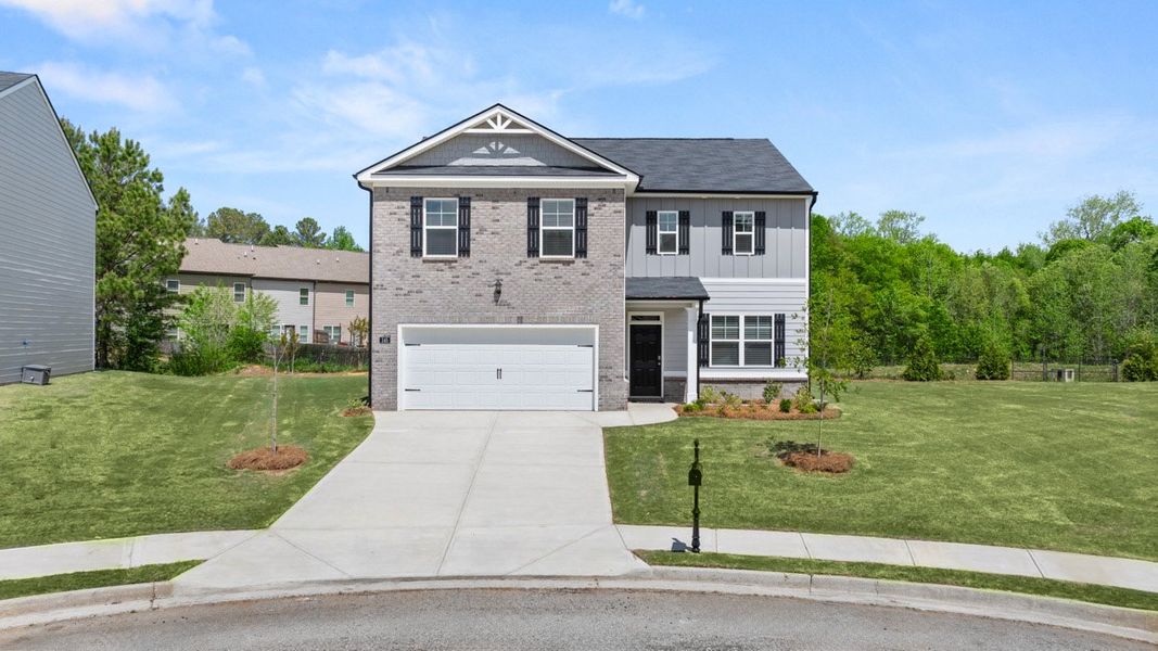 Front exterior of a new home in Locust Grove Station - Cedar Ridge, Locust Grove, GA, highlighting curb appeal (Image 2).