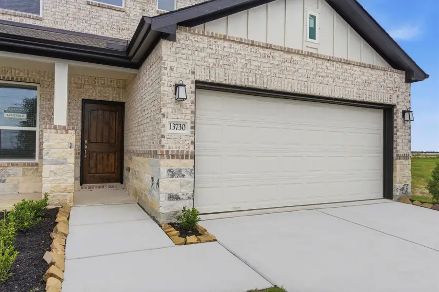 Exterior details and patio area of a home in , Iowa Colony (Image 3).