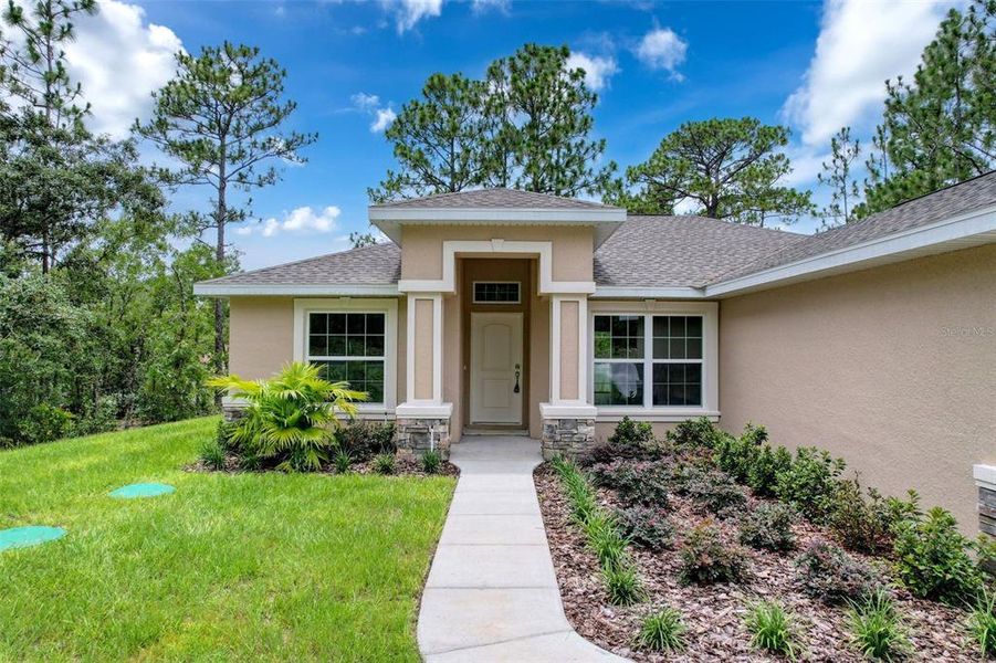 Front exterior of a new home in , Dunnellon, FL, highlighting curb appeal (Image 25).