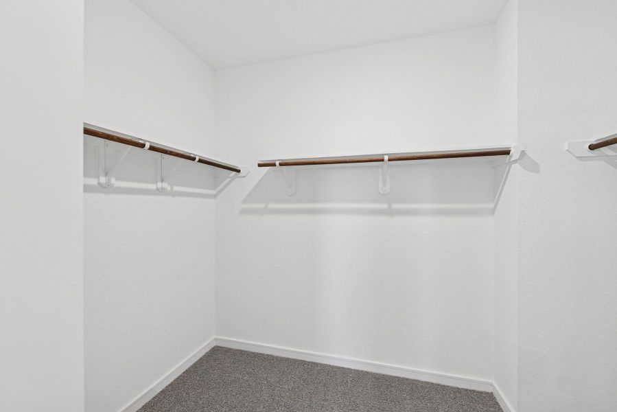 Spacious walk-in closet in primary suite (*Photo not of actual home and used for illustration purposes only.) Spacious walk-in closet in primary suite (*Photo not of actual home and used for illustration purposes only.)