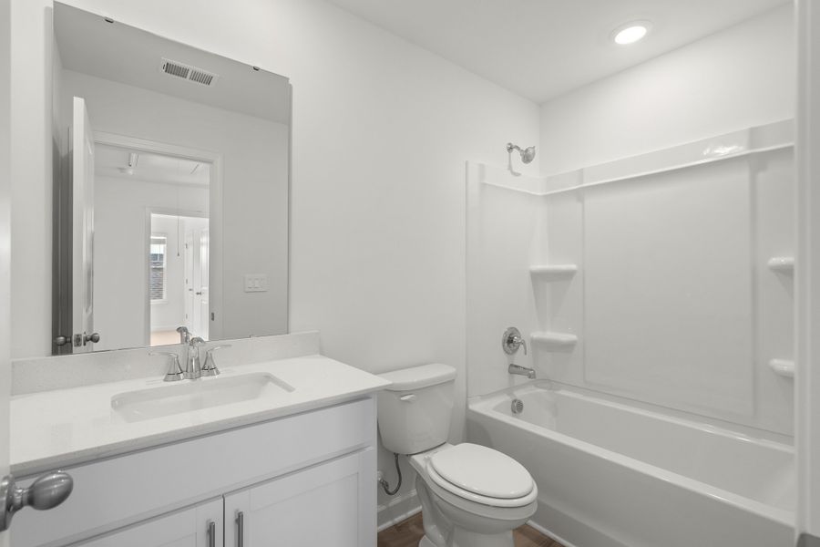 Furnished interior view inside a new home in Waterside - Boardwalk Series, Longs (Image 12).